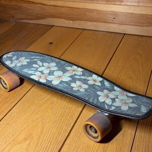 Floral Pattern Skateboard with Black and Tan Wheels
